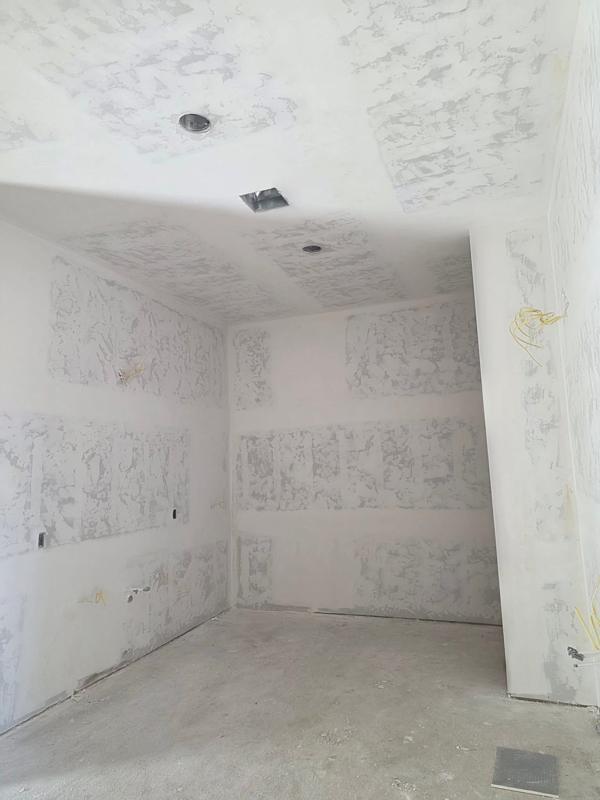 Bedroom drywall taped and floated, ready for texture