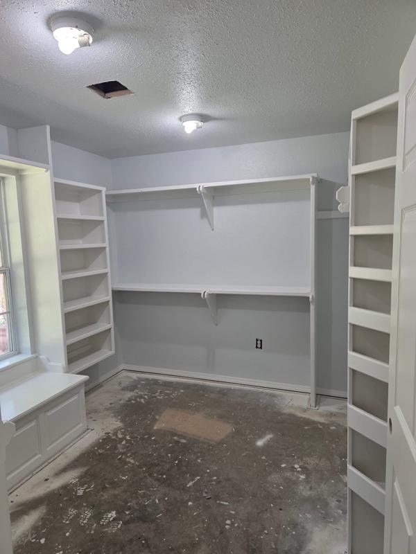 Closet shelving repainted, floors prepped for new flooring