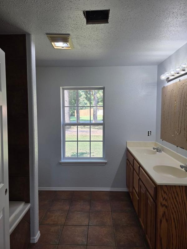 Bathroom repainted with vanity and tile floor