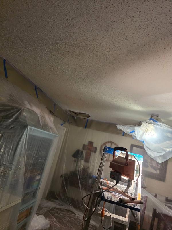 Ceiling finish work with the room fully protected