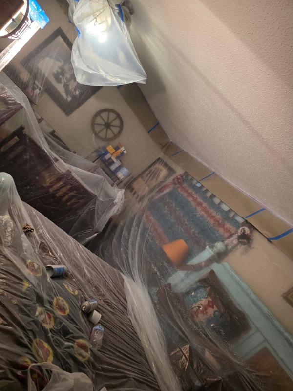 Furniture and decor covered while ceilings are finished