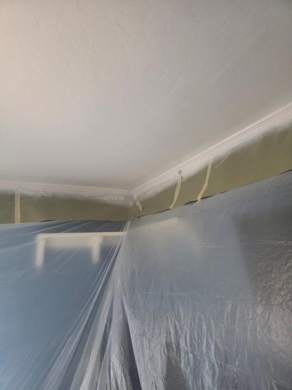 Finished ceiling with a crisp edge at the wall