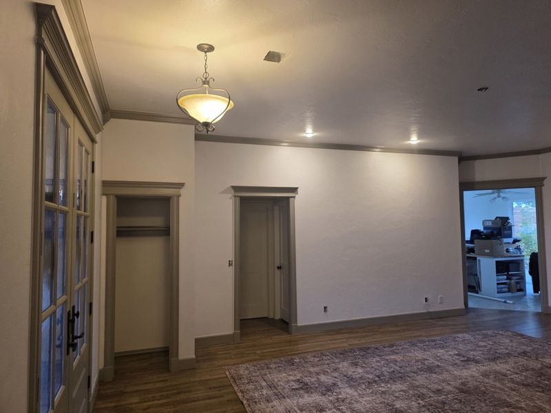 Living room with new crown, door casings and baseboards