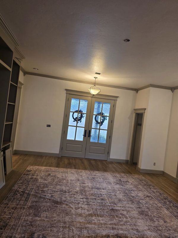 Entry with French doors, new casing, crown and baseboards